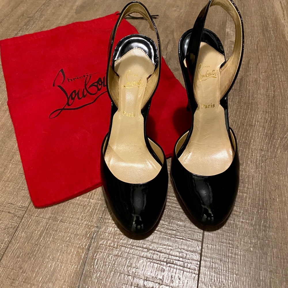 Christian Louboutin strap heel.